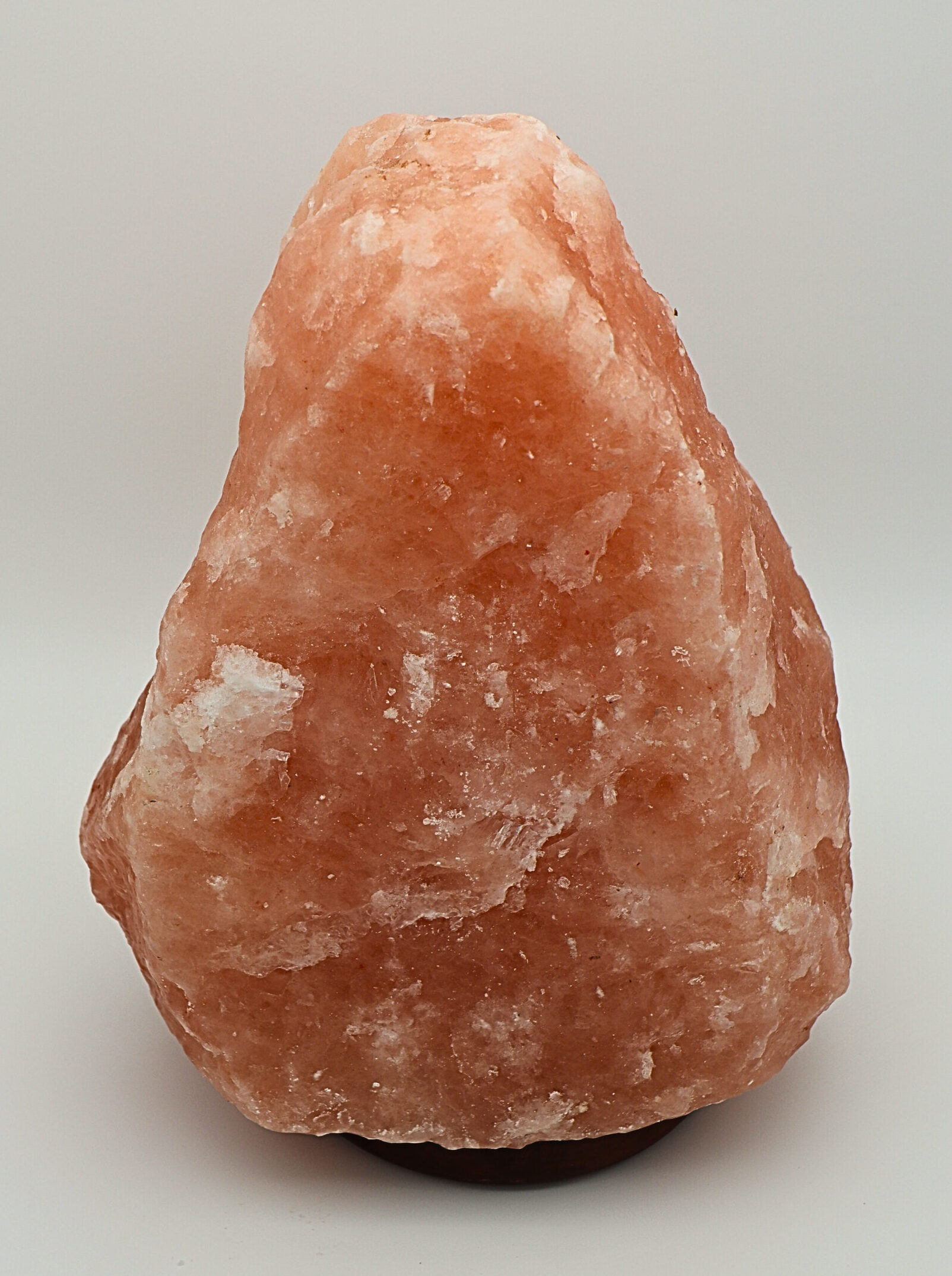 Salzlampe a salt lamp on a white surface